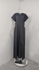 Detail of high-waist wide-leg black jumpsuit with V-neckline and functional side pockets