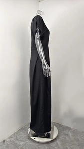 Detailed side view of sleeveless black wide-leg jumpsuit with waist pleats and H-line profile