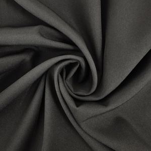 Detailed macro view of high-quality black fabric texture and soft drape for jumpsuits