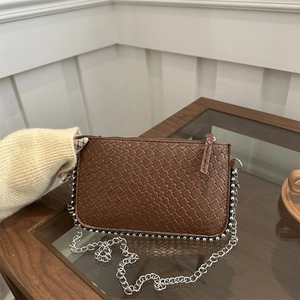 Brown woven crossbody bag with silver bead trim and metal chain strap for women