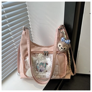 Detailed close-up of pink ita bag with large clear display window and nylon texture