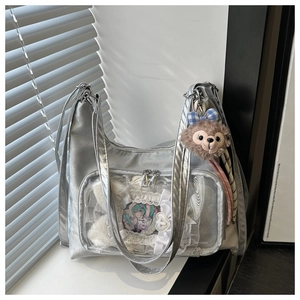 Detailed view of silver ita bag with clear window for displaying anime accessories