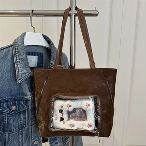 Brown glossy tote bag with transparent front pocket and cute plush cat accessory