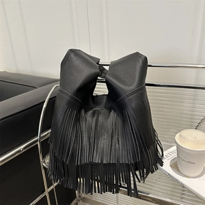 Minimalist black pebbled leather shoulder bag with stylish long tassels for women