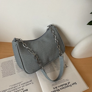 Minimalist grey textured shoulder bag with chain strap and herringbone weave fabric