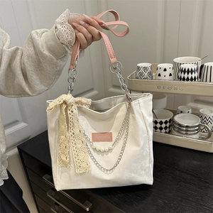 Large capacity tote bag with lace bow and pearl chain detail for daily commuting