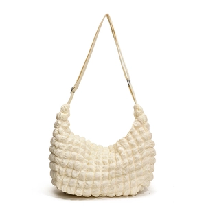 Off-white puff cloud bag with bubble texture and adjustable strap in minimalist style