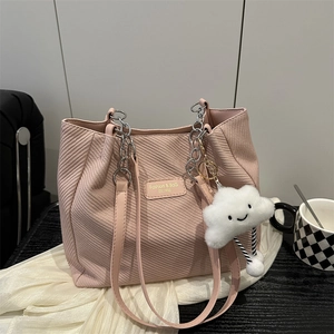 Pink large tote bag with diagonal texture, silver chain straps and cloud charm accessory