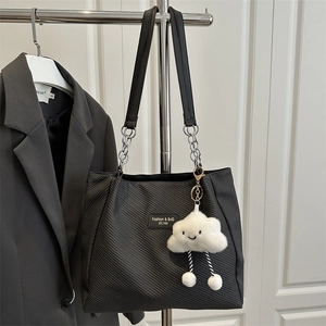 Chic black large capacity tote bag with chain strap and cute plush cloud pendant charm