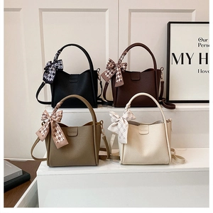 Litchi pattern bucket bags in four colors featuring decorative silk scarves on handles