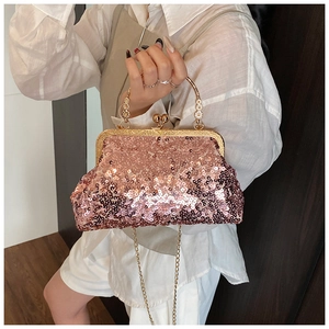 Pink sequin evening bag featuring a vintage gold clasp and elegant pearl chain handle