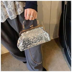 Silver sequin handbag with gold metal frame and ornate round handle detail