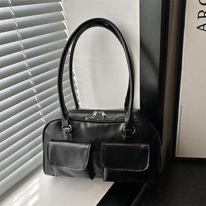 Matte black faux leather shoulder bag with dual front flap pockets and silver double zippers