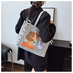 Detail of gray tote bag with Van Gogh sunflower print and ribbon lace-up decoration