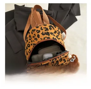 Mini leopard print corduroy bag showing internal storage for phone, wallet and earphones