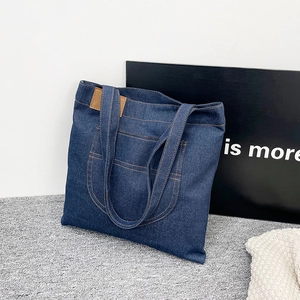 Large capacity dark blue denim tote bag with brown contrast stitching for daily commute