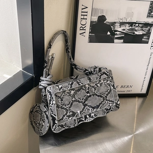 Snake skin pattern shoulder bag with wavy edge, clear PVC window and knotted handle