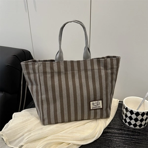 Striped corduroy tote bag for students featuring camping label and grey handles