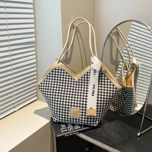 Classic houndstooth knit tote bag with beige trim and decorative logo strap for women
