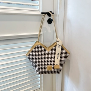 Classic houndstooth tote bag with cream leather trim and stylish V-shaped opening