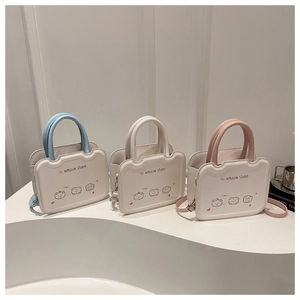 Minimalist crossbody biscuit bags in blue, white, and pink on geometric stands