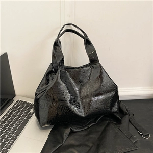 Chic black crocodile embossed tote bag with glossy finish for urban office commute
