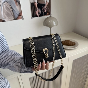 Classic black crocodile texture flap bag with gold horseshoe lock and chain strap