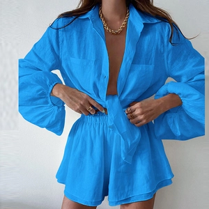 Detail of royal blue two-piece set featuring ruffled long sleeve shirt and shorts