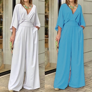 Detail of elegant V-neck jumpsuits with pleated waist and wide legs in blue and white