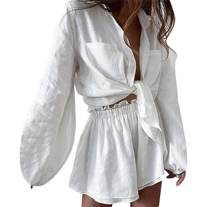 White linen cotton two-piece set featuring V-neck tie-front shirt and high waist shorts
