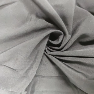 Macro texture of charcoal grey high-density fabric with elegant soft drape and fine weave