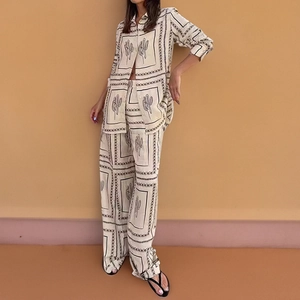 Women casual two-piece set with cactus print shirt and wide leg trousers in cream
