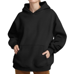 Front view of black oversized hoodie featuring kangaroo pocket and ribbed cuffs