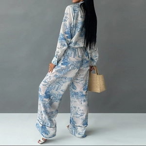 Women's two-piece set with blue ink print shirt and wide-leg trousers in vintage style
