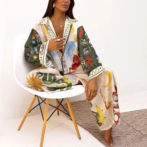 Women's two-piece set featuring long sleeve shirt and pants with astrology print