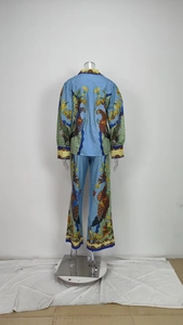 Detail of printed lantern sleeve top and flared wide-leg pants back view set