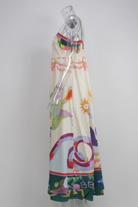 Detailed view of artistic illustration print and smocked elastic back on the maxi dress