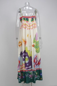 Detail of high waist bohemian maxi dress featuring artistic sun and star floral prints