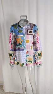 Detail of lapel long sleeve shirt with colorful patch print and Lucky Hair text design