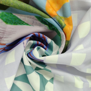 Macro shot of abstract geometric print fabric with colorful vibrant patterns and textures
