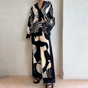 Modern two-piece fashion set with black and white abstract graffiti print and wide-leg pants
