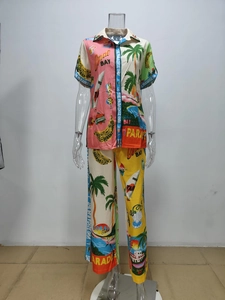 Detail of tropical graffiti print on a casual short-sleeve shirt and long pants set
