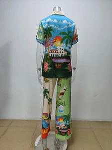 Detail of tropical palm print and Paradise Inn text on back of two-piece resort set
