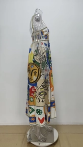 Detail of artistic graffiti print and premium satin texture on this colorful maxi dress