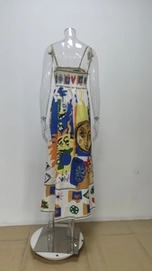 Close-up of bohemian floral print dress featuring Love text and Le Soleil art pattern