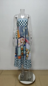 Detail of high-waist maxi dress featuring blue checkerboard and floral patchwork patterns