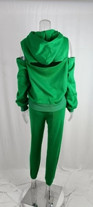 Detail of green fleece tracksuit featuring cold shoulder design and back cutout on hoodie
