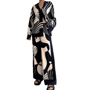 Women's 2-piece lounge set with black and white abstract print shirt and wide-leg trousers