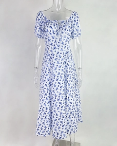 Detailed view of floral midi dress with milkmaid neckline and puff sleeves