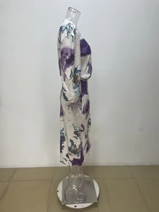 Detailed view of the artistic tie-dye pattern on the spring V-neck slim-fit dress